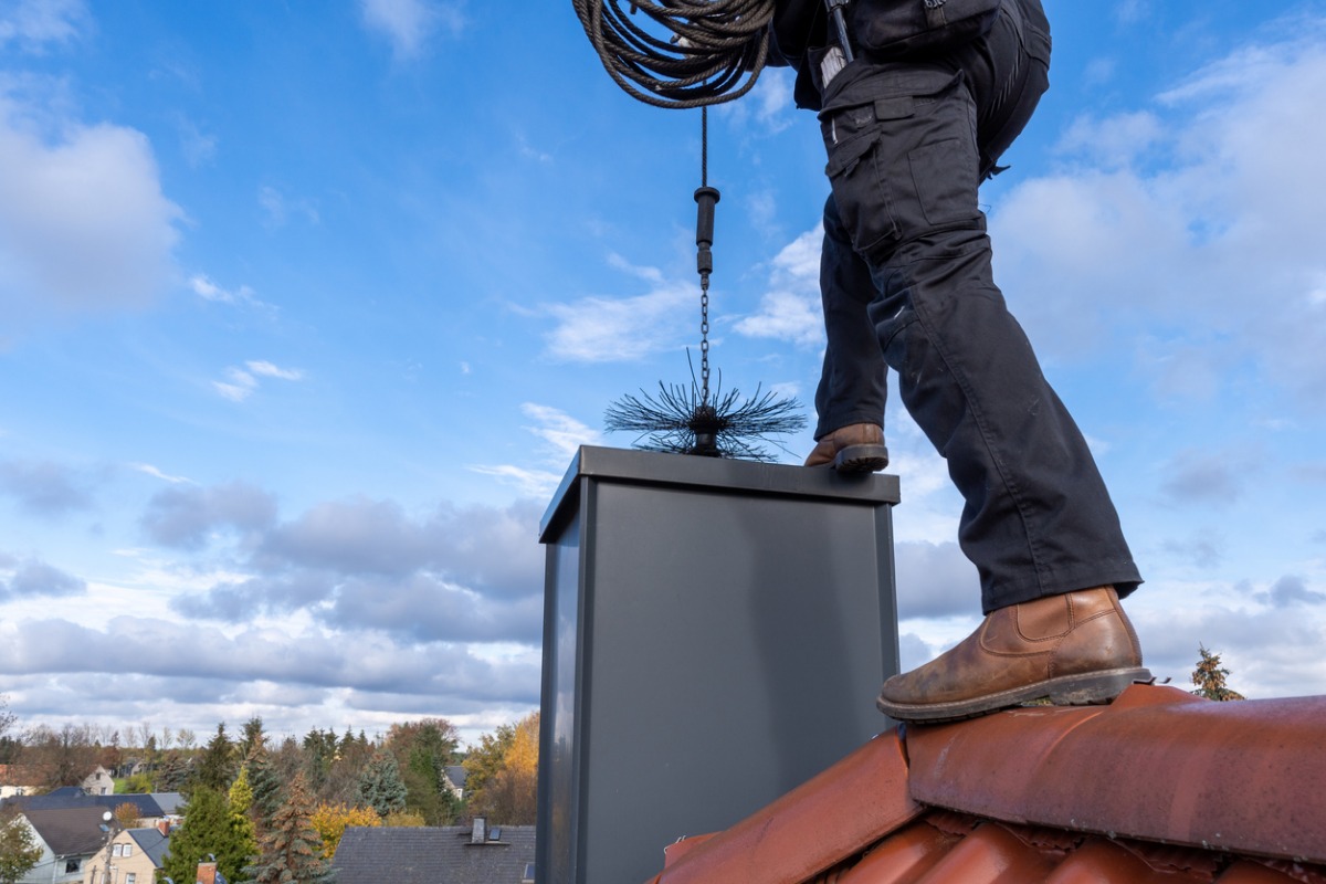 Chimney Sweep: Above and Beyond Home Services Inc - Thorough cleaning and maintenance for optimal chimney performance.